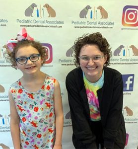 Careers C.Malia With Patient Lookalike Sml photo of dental employee with child
